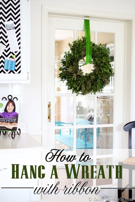 Christmas decorating idea using greenery. Decorating idea for hanging a Christmas wreath and ribbon. Hang A Wreath With Ribbon, Wreath With Ribbon, Wreath Hanging, Valentine's Day Decorations, Front Door Christmas Decorations, Seasonal Living, Rustic Christmas Wreath, Deco Mesh Christmas Wreaths, Diy Aesthetic