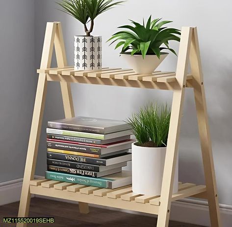 Product name : Wooden plant stand 2 tier foldable flower pot display shelf rack Price: Rs. 1300 Details: • Material: Wood • The Double-Layer Ladder Plant Stand Is Made Of High-Quality Pine Wood • And Has Been Treated With 3 Polishing Processes • Healthy Varnish, It Is Strong And Beautiful • A Charming Way To Display All Plants • Number Of Pieces: 1 Pc • Color: Brown • Package Includes: 1 x Double Layer Shelf • Note: There might be an error of 1-3 cm due to manual measurement, and s... Ladder Plant Stand, Layer Shelf, Pot Display, Wooden Plant Stand, Wooden Plant Stands, Shelf Rack, Solid Wood Flooring, Display Shelf, Flower Stands