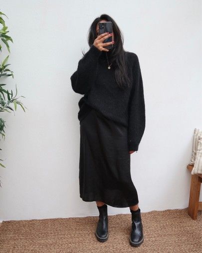 Slip Dress Jumper Outfit, Black Jersey Dress Outfit Winter, Jumper And Slip Dress, Long Black Dress With Sweater Over It, Black Slip Dress Sweater Outfit, Black Silk Dress With Sweater, Styling A Black Slip Dress, Long Black Skirt With Sweater, Black Midi Slip Dress Outfit