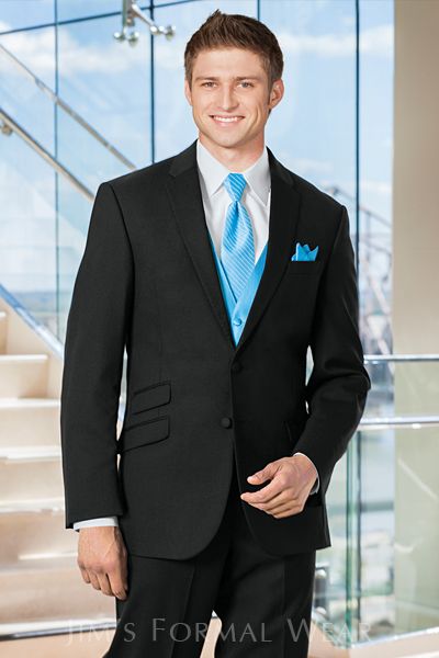 The Slim Fit Notch Tuxedo has a fine, pick stitch lapel, the kind of lapel you will only find on finer tuxedos and suits This classy tuxedo is shown here with a turquoise blue windsor tie... stylish! Prom Dress Jacket, Rose Gold Quinceanera Dresses, Quinceanera Dresses Gold, Evening Dresses Uk, Prom Tuxedo, Dance Costumes Ballroom, Rent Dresses, Groom Tuxedo, Tuxedo Style