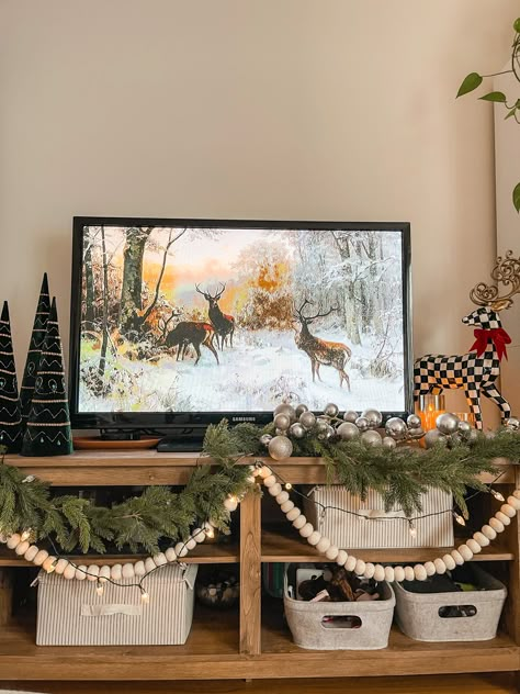 Minimalist Christmas Decor Tv Stand, Decorating Tv Console For Christmas, Tv Stand Xmas Decor, Entertainment Christmas Decor, Tv Console Xmas Decor, Christmas Decor Tv Stand Living Rooms, Tv Console Christmas Decor Ideas, Sides Of Tv Wall Decor, Christmas Decor On Tv Console