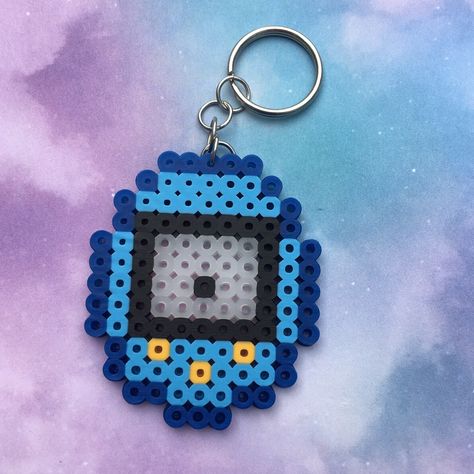 Tamagotchi Alpha Pattern, Tamagotchi Perler Beads, Tamagotchi Pixel Art, Blue Tamagotchi, Tamagotchi Template, Cute Tamagotchi, Nerdy Perler Beads, Melted Bead Crafts, Melt Beads Patterns