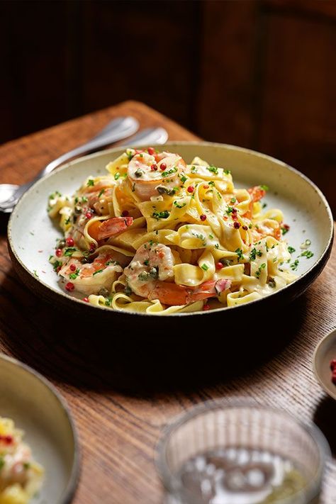 This luxuriously creamy pasta is packed with the flavours you would expect from a bowl of comforting seafood. You simply can’t go wrong with a white wine, fish stock, caper and cream combo. The pink peppercorns are optional, but they make a dramatic garnish and are easy to get hold of. Tagliatelle Recipe, Tom Kerridge, Fish Stock, Creamy Pasta, A Bowl, The Pink, White Wine, Pasta Recipes, Seafood