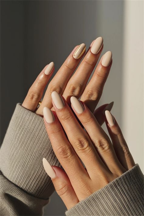 Elevate your look with these chic short simple nail ideas that are perfect for any occasion! This style features a delicate pastel base with a minimalist line design, allowing your natural elegance to shine through. Ideal for those who love sophistication without the fuss, these nails are both trendy and easy to maintain. Embrace simplicity this season! Beige Nails Almond Shape, Low Maintenance Nail Design, Natural Beige Nails, Short Almond Shape Nail Ideas, Minimalist Nails Fall 2024, Creme Color Nails, Short Beige Nails, Light Fall Nails, Short Simple Nail Ideas