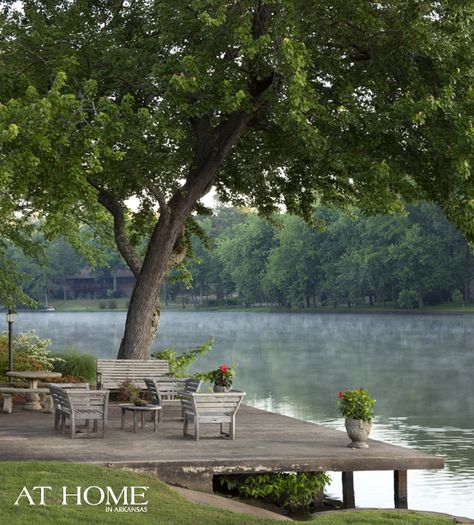 On the dock, weathered teak furniture provides a place to take in the view of the North Little Rock Lake. Lake Dock, Lakeside Living, Lake Living, Lake Cottage, Body Of Water, Lake Cabins, River House, Boat Dock, Home Design Decor