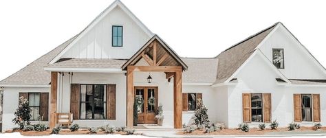 Black pendant light hangs from a gable porch roof with stained wood trusses. The gable porch frames a stained wood front door fitted to a white house with gray shingle roof. Gable Porch, Rustic Farmhouse Plans, White Exterior Houses, French Country House Plans, Porch Roof, Dream Life House, Modern Farmhouse Exterior, Barn Style House, House Plans Farmhouse