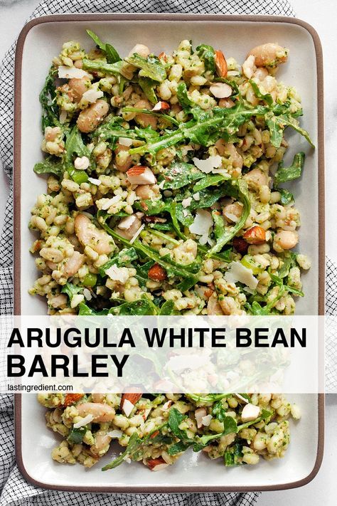 Ready in less than 20 minutes, this vegetarian arugula cannellini bean barley with almonds and Parmesan is a filling grain side that you can serve as a salad, too. Canneli Bean Recipes, White Bean Arugula Salad, Pearled Barley Salad, Fennel White Bean Salad, Fennel And Arugula Salad, Arugula Barata Salad, Bean Salad Healthy, Cannellini Bean Salad, Vegetarian Side Dish Recipes