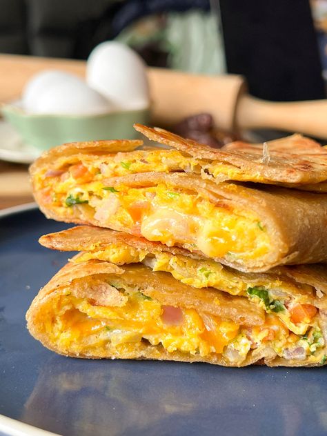 Egg Paratha Wrap Paratha Breakfast Ideas, Egg Paratha, Lemon Chicken Rice, Bacon Avocado, Breakfast Wraps, Classic Breakfast, Chicken Rolls, Vegetarian Snacks Recipes, Egg Bites