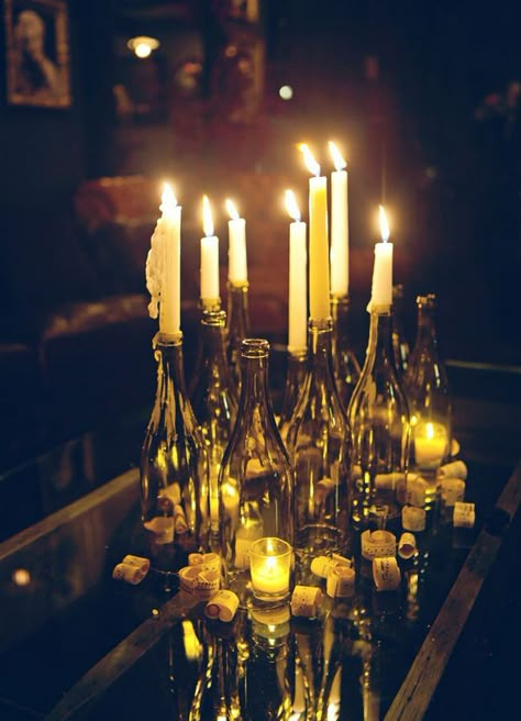 Wine bottles with candles #weddingdecor #Gatsbywedding #tablescape #weddingideas #reception Mafia Theme, Mafia Party, Speakeasy Wedding, Speakeasy Decor, Prohibition Party, Gatsby Birthday, Speakeasy Party, Charm Party, Speak Easy