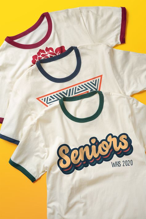 Put a new spin on an old classic. Check out our favorite design ideas and templates for helping you make your custom t-shirts shine. University Shirt Design Ideas, Class Tshirts, Senior Class Shirts, Minimal Shirt Design, Class Shirts, Class Shirt, 70s Shirts, Shirt Logo Design, Senior Shirts