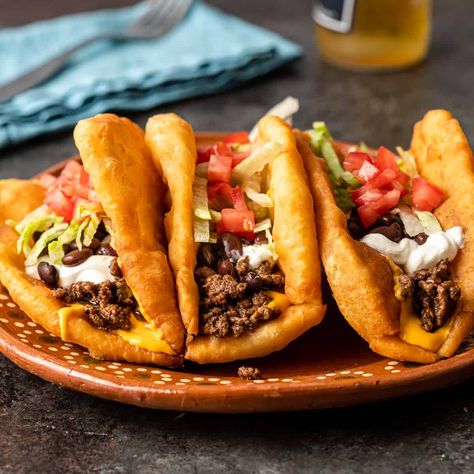 Make Navajo Tacos with crispy homemade Indian fry bread and your favorite fillings, or top the shells with honey and sugar for a sweet treat! Slow Cooker Flank Steak, Chalupa Recipe, Indian Fry Bread, Cranberry Nut Bread, How To Make Beans, Navajo Tacos, Flank Steak Tacos, Indian Tacos, Fried Bread Recipe