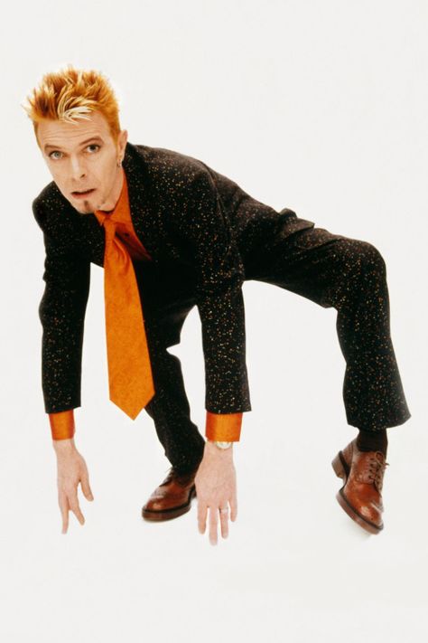 David Bowie dressed in Paul Smith suit during a fashion shoot for British GQ, London, August 5, 1997 © Peter Robathan David Bowie Dress, Bowie Fashion, Angela Bowie, Bowie Dress, Duncan Jones, David Bowie Fashion, Bowie Starman, David Bowie Ziggy, Space Oddity