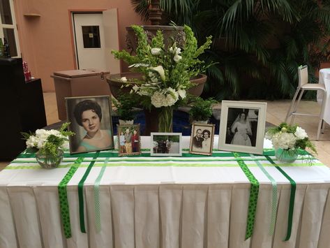 Irish Wake Irish Memorial Ideas, Memory Table Retirement, Memory Tables For Funerals, Irish Wedding Table Centerpieces, Irish Flower Arrangements, Photo Displays For Funerals, Irish Wake, Memorial Service Decorations, Irish Celebration