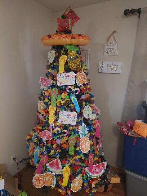 There are sandals, sunglasses, flamingos, fruit, and pool floties on the Tree. I used Lei flowers as well. All Year Round Christmas Tree, Holiday Trees Year Round, Year Round Christmas Tree Ideas, Year Round Christmas Tree, Summer Christmas Tree, Summer Xmas, Decorated Trees, Summer Tree, Tree Theme