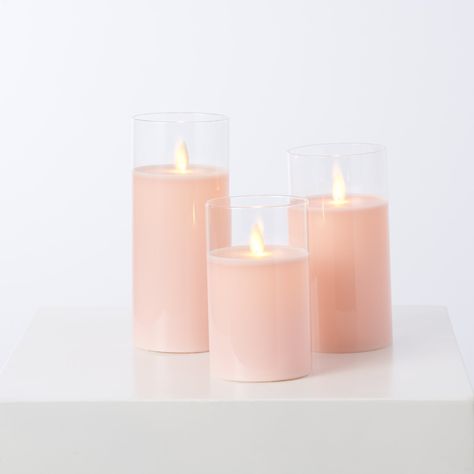 Features: Set of 3 5" H x 3" W 6" H x 3" W 7" H x 3" W Wax + Glass Moving Flickering Flame AAA Battery Operated Batteries Sold Separately 4 hour timer Remote Included Indoor Use Imported Experience the aesthetic of a flickering candle in any environment with our Moving Flameless LED Glass & Light Pink Pillar Candles with Remote. This set of three provide a high-quality, authentic wax look with a subtle flame effect. Pink Votive Candle Holders, Flameless Candles Wedding, Pink Sands Candle, Pink Flameless Candles, Pink Pillar Candles, Pillar Candle Centerpieces, Color Durazno, Flickering Candle, Cylinder Candles