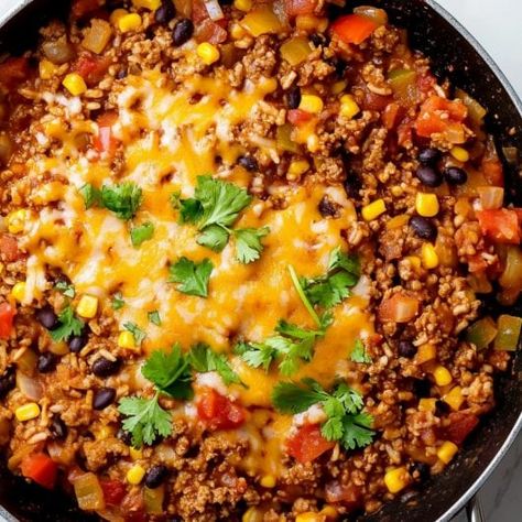 Mexican Beef and Rice Skillet Beef Skillet Enchiladas, Taco Skillet Dinner, Mexican Beef And Rice Skillet, Beef Taco Skillet, Beef And Rice Skillet, Skillet Enchiladas, Mexican Skillet, Mexican Ground Beef, Taco Skillet