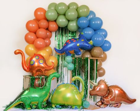 "♦ Package Includes (whole set): - Balloon garland (assortment of Amber yellow, rust orange, retro blue, eucalyptus green, and mocha balloons in 10-12 inches) - 1 packs of green streamer - 5 Dinosaurs (style #1,2,5,7,8 by default) - 16 inches letters of \" RAWR\" phrase in black (customized-able)  - Straw - Hanging string - Garland chain - Dot glue - Tying tool - Easy to follow step-by-step instructions. A Dual-action hand pump is HIGHLY RECOMMENDED! The picture shows a 8-foot garland. 1 FT = 9 balloons (12-inch) ------------------------------------------------------------- No experience is needed, super easy! ------------------------------------------------------------- ♦We use the HIGHEST QUALITY, eco-friendly Europe and US balloons to give you a creamy, double-stuffed look without the h Tree Rex, Party Arch, Dinosaur Birthday Party Decorations, Blue Eucalyptus, Dinosaur Balloons, Dinosaur Themed Birthday Party, Eucalyptus Green, Orange Retro, Dino Party