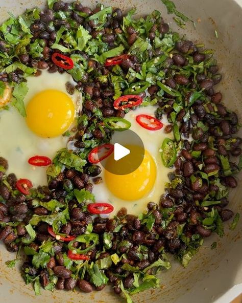 Melissa Hemsley 🌱feelgood food on Instagram: "Bank Holiday Black Bean eggs👇🏽 10 minutes and you’ve got a pan of sunny joy. 

3 tbsp olive oil
1x 400g tin black beans, drained and rinsed
1 large garlic clove, finely grated
1 heaped tsp smoked paprika
Large handful of chopped coriander
eggs - however many you can fit in the pan 
1 fresh red or green chilli, finely sliced
1 avocado, de-stoned, peeled and roughly chopped
1 lime
Sea salt

Heat 2 tbsp olive oil in a large frying pan, once hot add the beans, a pinch of salt and pepper. Fry for a few minutes then add the garlic and paprika. Fry for a minute or so until fragrant then stir through the coriander. 

Make two gaps in the pan, drizzle a little more olive oil into each gap then crack in the eggs. Fry for a few minutes until the whites Melissa Hemsley, Garlic Clove, Green Chilli, Black Bean, Smoked Paprika, Bank Holiday, Frying Pan, Black Beans, Sea Salt