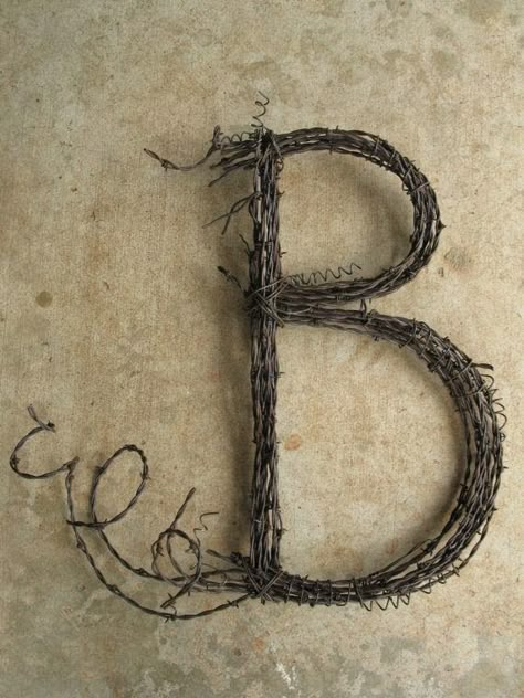 Brown. Let me count the ways I love you. Brown and November go hand in hand don't you think? Is it any wonder chocolate is brow... Barbed Wire Wreaths Diy, Barbwire Crafts, Driftwood Project, Barbed Wire Decor, Junk Sculpture, Barb Wire Crafts, Wire Wreaths, Barbed Wire Art, Wire Letters