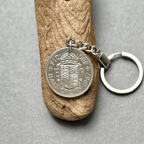 1967 British Half Crown coin keyring, a perfect, 57th birthday, anniversary or retirement gift With all my keychains I use a good strong split ring and chain that match the colour of the coin All my key chains come in a pretty little burlap gift pouch ready for gifting The coins that I use to make my jewellery and key rings are genuine circulated coins that have been sterilised and polished by hand, they may have slight marks or signs of wear in keeping with their age Coin Jewellery, 57th Birthday, Half Crown, Retirement Gift, Coin Jewelry, Gift Pouch, Split Ring, Retirement Gifts, Key Chains