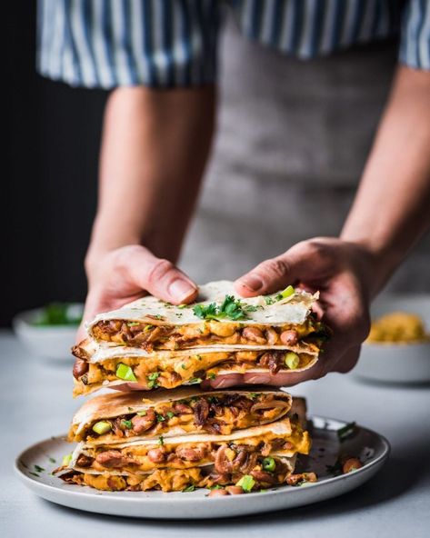 These vegan quesadillas are made with a spreadable smoky cashew cheese, easy spiced refried beans, and sticky sweet onions, making them the ultimate comfort food! Plus, they’re made with exclusively pantry ingredients! Quesadilla Vegetarian, Quesadilla Vegan, Pork Quesadilla, Vegan Quesadillas, Pulled Pork Quesadilla, Cashew Cheese Recipe, Vegan Quesadilla, Spreadable Cheese, Sweet Onions