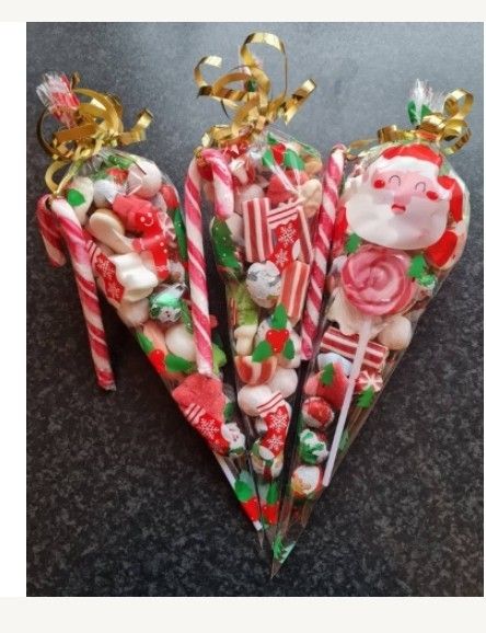 Filled with festive sweets and lolly with an extra candy cane Christmas Sweet Cones, Cone Ideas, Sweets Party, Sweet Cone, Christmas Candy Gifts, Lolly Bags, Candy Cone, Sweet Cones, Santa Face