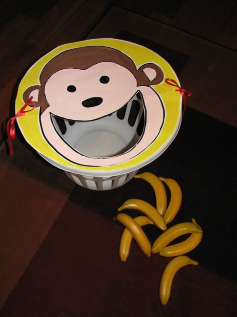 "Feed the _____" Game - make an animal face out of poster board and tie onto the top of a round laundry basket
Use fake food to toss in! Zoo Themed Games, Monkey Activity For Preschool, Jungle Themed Games, Monkey Activities For Preschool, Jungle Party Games, Preschool Jungle, Zoo Preschool, Monkey Banana, Monkey Crafts