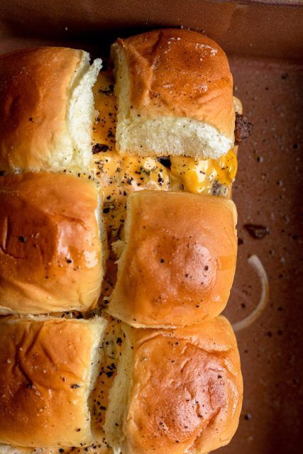 These easy baked cheeseburger sliders are the perfect finger food. Hawaiian rolls, ground chuck, onion, melty American cheese, pickles and burger sauce. There is no better combination. Cheese Burger Sliders Hawaiian Rolls, Baked Cheeseburger, Hawaiian Buns, Cheese Pickles, Ground Chuck, Hawaiian Roll Sliders, Aubergine Recipe, Cheeseburger Sliders, Burger Sliders