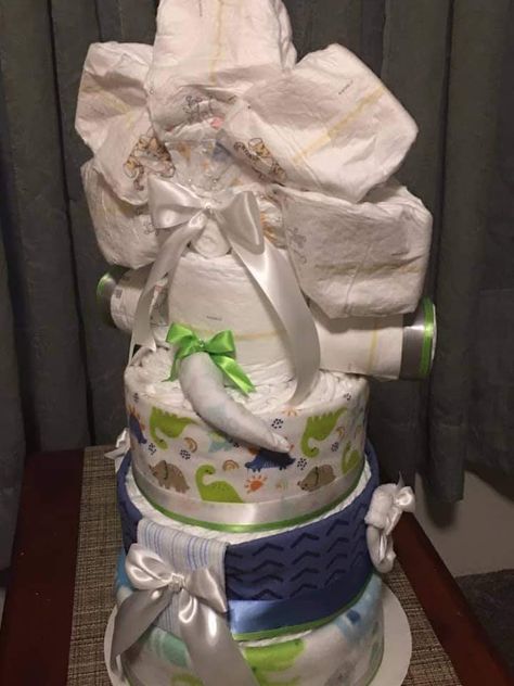 Dino Diaper Cake, Dinosaur Baby Shower Ideas, Dinosaur Diaper Cake, Dino Decor, Dinosaur Baby Shower Theme, Diaper Gifts, Nappy Cake, Diaper Cake Boy, Boy Diy