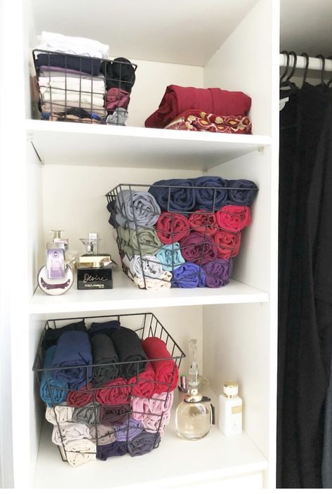 I use Kmart baskets to store my hijabs. I simply roll them up and try to organise them by fabric and colour. I also use the small basket to store my hijab caps. Wardrobe Organisation Shawl, Hijab Organisation, Hijab Organization Ideas, Hijabs Organised, Hijab Organization, Organization Clothes, Young Adult Bedroom, Closet Organisation, Scarf Organization