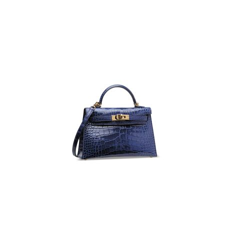 A SHINY BLEU SAPHIR ALLIGATOR MINI KELLY 20 II WITH GOLD HARDWARE, HERMÈS, 2017 | Christie's Blue Mini Kelly, Mini Kelly Hermes, 2024 Bags, Mini Kelly, Handbag Accessories, Alligator, Gold Hardware, Dark Blue, Dust Bag