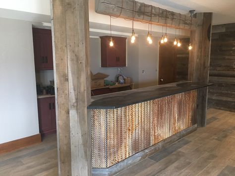 A bar built out of rustic tin Tin Walls Rustic Kitchen, Corrugated Tin Ceiling Kitchen, Tin Walls Rustic, Rustic Tin Bar Ideas, Using Corrugated Metal Interior Design, Kitchen Island With Tin Corrugated Metal, Barnwood And Tin Door, Barn Wood And Tin Cabinets, Barn Bar