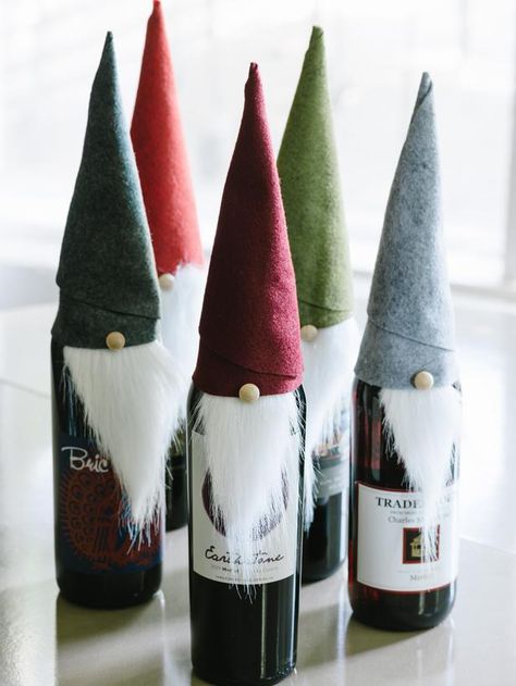 Tooo Cute! Homemade Christmas gift ideas from HGTV. Definitely need to check this out!   Elf Wine Bottle Covers - 8 Easy Handmade Holiday Gifts for Hosts on HGTV Joululahjat Diy, Gnome Hats, Holiday Hostess Gifts, Handmade Holiday Gifts, Wine Bottle Covers, Navidad Diy, Wine Bottle Crafts, Homemade Christmas Gifts, Tolu