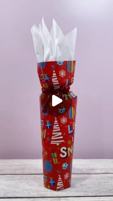 Tracie Garrett on Instagram: "How to wrap a Starbucks Tumbler #wrapping #wrappingpresents #giftwrapping #giftwrappingideas" How To Gift Wrap Drinks, How To Wrap A Tumbler For Christmas, How To Wrap A Yeti Cup As A Gift, Cylinder Wrapping Ideas, How To Wrap A Tumbler, Wrapping Cylindrical Gifts, How To Wrap A Cup With Wrapping Paper, Tumbler Gift Wrapping Ideas, How To Wrap A Vase Gift