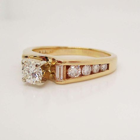 For Sale on 1stDibs - This absolutely beautiful ring is in 14k yellow gold and has a stunning collection of baguette and round diamonds to accent the brilliant white round center 80s Style Engagement Rings, Unusual Engagement Ring, Thick Gold Band Wedding Ring, Antique Gold Engagement Ring, Modern Vintage Engagement Rings, Vintage Engagement Ring Styles, Unique Vintage Engagement Rings, Victorian Style Engagement Ring, Antique Engagement Rings Victorian