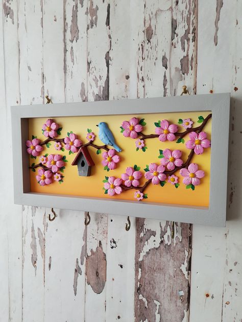 Excited to share the latest addition to my #etsy shop: Nature Scenery Key Hanger For Wall / 3D Blue Bird and Pink Flower Tree Key Chain Hanger / Wooden Deep Frame Unique Design Home Gift Idea #coastaltropical #entryway #walldecorkeyhook #keyholderdecor #flowerloversgift #housewarminggift #keyholderforwall #flowergardenart https://etsy.me/3R3Gf92 Wood Frame Decor Ideas, Wooden Hanging Decor, Wall Hanging Showpiece, Lippan Art Bird Design, Diy Wooden Key Holder Ideas, Clay Name Plates For Home, Key Holder Ideas Creative, Clay Key Holder, Pichwai Wall Hanging