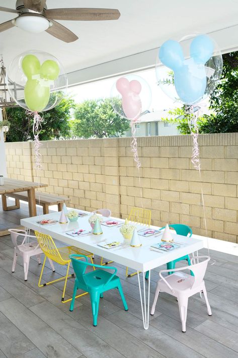 Charlotte's Pastel Disneyland | CatchMyParty.com Vintage Disneyland Party Decorations, Disneyland 3rd Birthday Party, Disneyland Pastel Birthday, Disneyland Party Games, Disneyland Party Food, Disney Centerpieces Birthday, Disneyland Party Ideas, Disneyland Centerpieces, Disneyland Birthday Cake