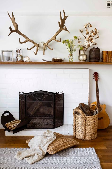 An earthy and eclectic cottage on Sydney's North Shore Antlers Over Fireplace, White Brick Fireplace, Brick Hearth, Timber Gates, Antlers Decor, Brick Look Tile, Eclectic Cottage, Red Bluff, Orange Chair