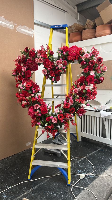 Transform your space into a romantic haven with our exquisite Valentine's Flower Display Wreath, designed to steal hearts and elevate your decor. Crafted with care in the UK, this stunning heart-shaped wreath is the perfect addition to large windows, restaurants, or shop displays, setting the mood for love and celebration. 🌹 Key Features: - Size 120 cms x 120 cms  - Made to Order in the UK: Each wreath is meticulously handcrafted just for you, ensuring that you receive a one-of-a-kind piece. - High-Quality Silk Flowers: Our wreath is adorned with lifelike tulips, roses, and cherry blossoms, made from premium silk materials that mimic the beauty of real blooms. - Long-Lasting Elegance: Designed to withstand the test of time, this wreath is a timeless investment that you can enjoy for years Vitrine Saint Valentin, Heart Window Display, Valentine Flowers, Valentine Window Display Store Fronts, Valentine’s Day Boutique Display, Window Displays Retail Store Fronts Valentines Day, Florist Window Display, Florist Valentines Window Display, Valentine’s Day Store Window