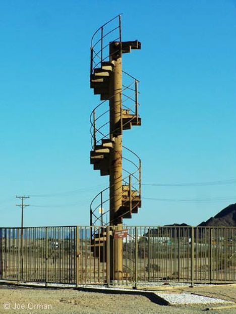 Stairway at the Center of the World.   Jacques-Andre Istel believes that he has identified the exact center of the world, and that it is on his own land in Felicity, California. This town, named after Istel’s wife, is packed with all kinds of bizarre and fascinating monuments, including a spiral staircase that was salvaged from the Eiffel Tower in 1989. Spiral Stairs, Stairway To Heaven, Spiral Staircase, The Eiffel Tower, Staircases, Romeo And Juliet, Chia, Surrealism, Eiffel Tower