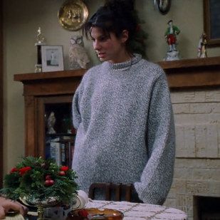 Lucy’s amazing oversized wool sweater inspires major envy. So big it can store gifts up the sleeve! | 23 Reasons "While You Were Sleeping" Should Be Your Favourite Christmas Movie Lucy While You Were Sleeping Outfits, Lucy While You Were Sleeping, Sleeping Outfits, Oversized Wool Sweater, Larry Wilcox, Frazzled English Woman, Nora Ephron, Quoi Porter, While You Were Sleeping