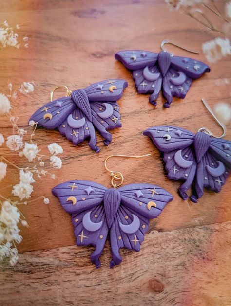 ✨Purple Mystical Moth Earrings | Dark cottagecore witch collection ✨ ⭐MATERIALS USED⭐ - Stainless Steel (tarnish resistant, more resistant than gold plated and safe for sensitive skin) - Polymer Clay (durable, flexible, waterproof and very lightweight) - Handmade Pieces, each piece is carefully shaped, painted, baked, sanded, cleaned and assembled by hands. ⭐REFUND INFORMATION⭐ - This product is not refundable - Please read all specifications before purchasing.  - Exception to refund policy at s Resin And Polymer Clay, Sculpey Jewelry, Unique Polymer Clay Earrings, Witchy Polymer Clay Ideas, Polymer Clay Witch, Fantasy Polymer Clay Earrings, Witchy Earrings Clay, Polymer Clay Jewellery, Moth Clay Art