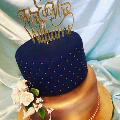 Navy Blue And Rose Gold Wedding Cake Double layered vanilla cake with navy blue fondant and quilted with gold accents. Bottom double... Royal Blue Cakes For Men, Navy Blue Gold Cake, Birthday Cake Blue And Gold, Navy Blue And Gold Cake, Rose Gold Birthday Party Ideas, Blue And Gold Birthday Cake, Blue Fondant Cake, Royal Prince Birthday Theme, Rose Gold Birthday Cake