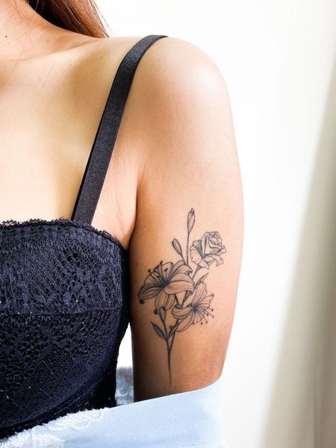 Tattoo Ideas Female Flower Arm, Floral Tattoo Arm Placement, Carnation And Lily Tattoo, Tattoo Ideas Female Lily Flower, Floral Bouquet Tattoo Placement, Female Tattoo Placement Ideas, Carnation Flower Tattoo Arm, Back Of Bicep Tattoo Women, Tattoo Ideas Female Cover Up