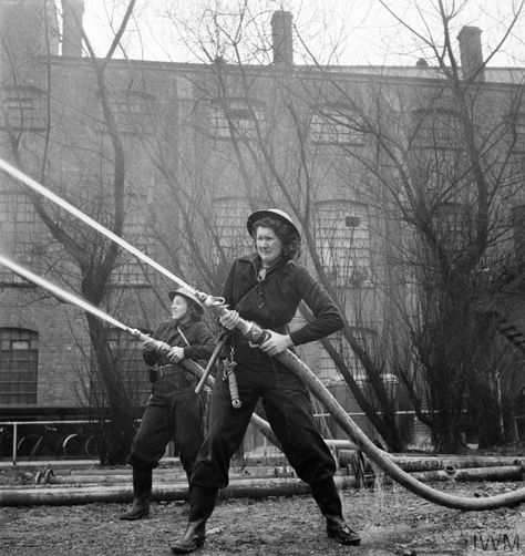 Members of the Women's Fire Guard in action with hoses at the factory of Boxfoldia Ltd. in Bournbrook, Birmingham. Boxfoldia Ltd produces cardboard packaging for the food industry, so an effective Fire Guard is extremely important at this factory. Fire Guard, London Blitz, Fire Training, Female Firefighter, Fire Equipment, British Women, The Blitz, Birmingham Uk, Dog Search