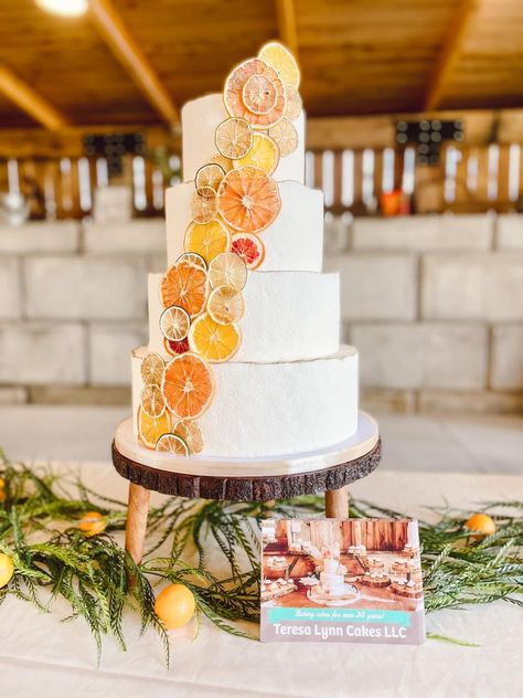 Tiered wedding cake with dried citrus fruit for a springtime wedding. Wedding Cake Dried Fruit, Passionfruit Wedding Cake, Orange Slice Wedding Cake, Dried Citrus Decorations Wedding, August Wedding Cake, Citrus Decorated Cake, Dried Fruit Cake Decoration, Dried Fruit Wedding Cake, Dried Citrus Cake