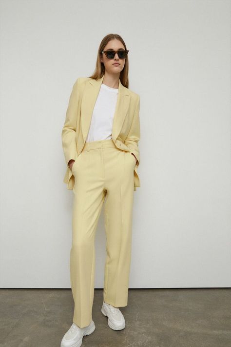 From relaxed tailored to sharp silhouettes, suiting is a wardrobe foundation. For an office look opt for structured pant sets in perennial pinstripes or classic black and navy hues. Style soft wide leg trousers with slouchy blazers for an effortless outfit for post-lockdown meet-ups. Pair with trainers or heels to maximise the versatility of a trouser suit. Shop the full collection of women’s suits. Pale Yellow Suits Women, Women’s Trouser Suit, Pastel Colored Outfits Women, Yellow Trousers Outfit, Tailored Suit Women, Wide Leg Trousers Outfit, Pastel Blazer, Pant Outfits For Women, Rich Outfits