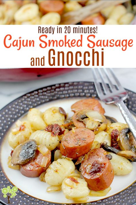 Smoked sausage cooked up with onion, mushrooms, garlic, sun-dried tomatoes, and lots of Cajun seasoning, then served with super easy gnocchi. This new dinner idea is ready in under 20 minutes and versatile so we can change it up however we like to help us during this busy time of the year. #cajun #gnocchi #easydinner #quickcook #sausage #food #recipe Smoked Sausage And Gnocchi, Easy Gnocchi, Cajun Sausage, Smoked Sausage Recipes, New Dinner, Kielbasa Recipes, Gnocchi Recipes, Sun Dried Tomatoes, Cajun Seasoning