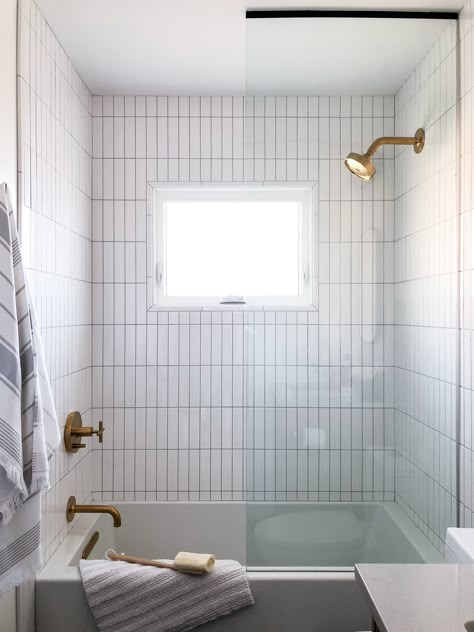 Step Down Tub Shower Combo, Vertical Tile Shower Ideas With Tub, Bathroom Vertical Tiles, Vertical Subway Tiles Bathroom, Freestand Tub Shower Combo, Bathroom Tile Vertical, Tub With Half Glass Wall, White Vertical Tiles Bathroom, Tub Half Glass Wall