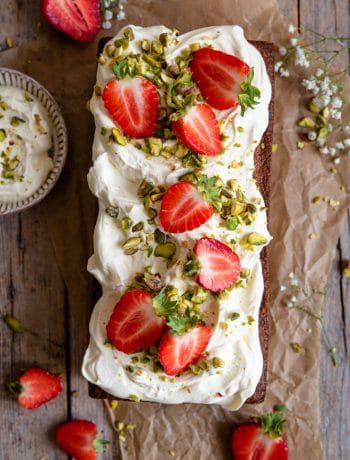 An overhead shot of a pistachio cake on a rustic wooden surface Strawberry Pistachio, Cake With Strawberries, Pistachio Cake, Chocolate Cream Cheese, Strawberry Cakes, Piece Of Cake, Food Processor, Strawberries And Cream, Let Them Eat Cake